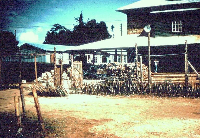 Barbed wire and bamboo pointed punk sticks surrounded the school to deter attacks